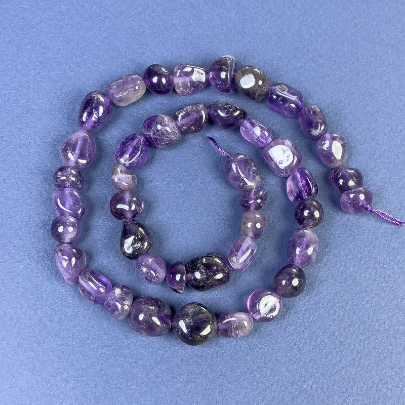 Amethystperlen, facettiert, 5–12×10 mm ±, auf Schnur, Länge ca. 40 cm+