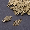 Schmuckzubehör Anhänger Handfläche Bronze, Ø 12 mm, Länge 20 mm, Bohrung Ø 3 mm, Verpackung 20 g ± 36 St.