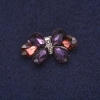 Brosche „Schleife“ in Kristallen, silberfarbenes Metall 17×30 mm
