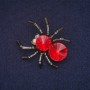 Brosche „Spinne mit rotem Kristall“
