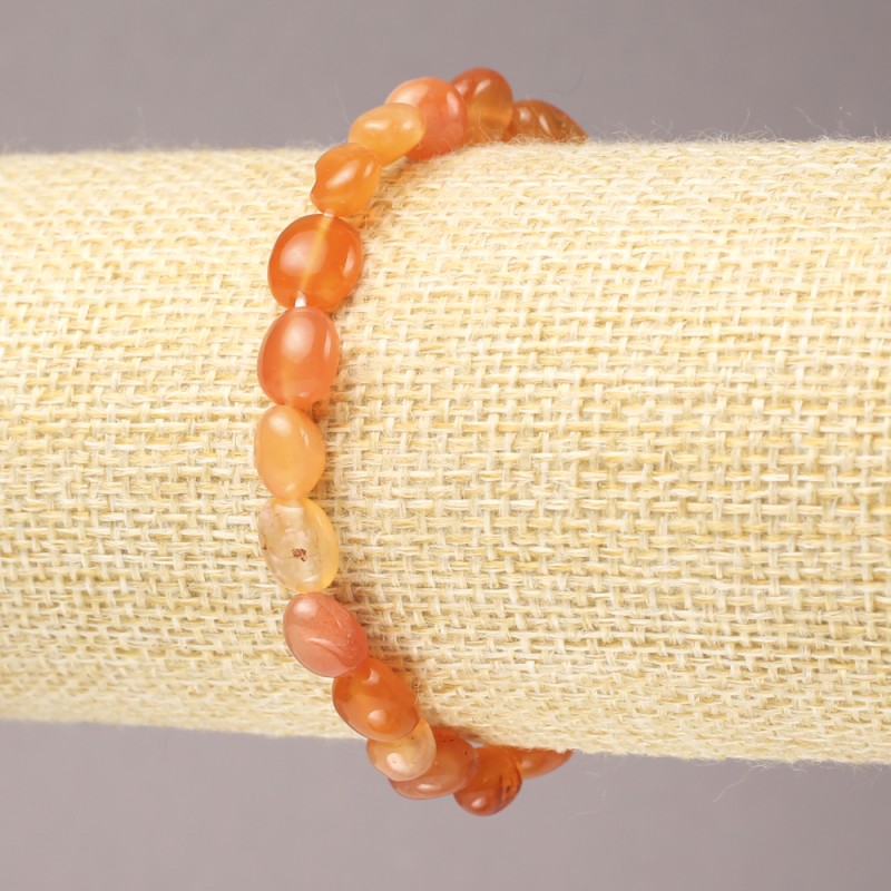 Elastikarmband aus Karneol, facettierte Perlen, Ø 9×7 mm+